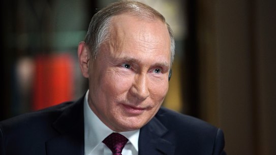 Putin easily wins another six-year term, firms grip on Russia