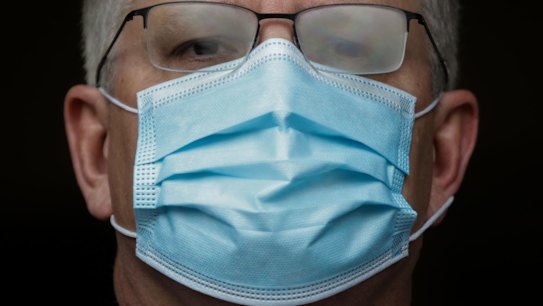 PM Scott Morrison wears a mask during a press conference.