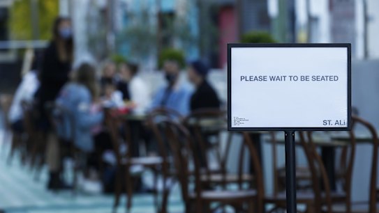 People are seen dining outside St. Ali Cafe in South Melbourne on October 28, 2020 in Melbourne, Australia. 