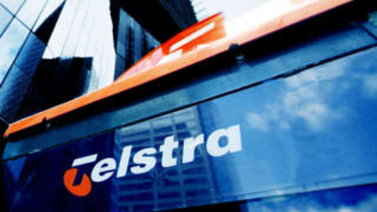 Telstra flags job losses as profit, dividend falls