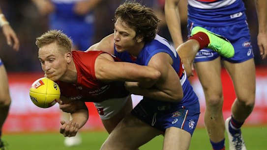 Picken pockets: Melbourne's Bernie Vince gets dispossessed.