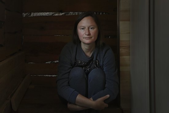 Natalia Kulakivska sits at her home in Bucha where she waits for news of her missing husband Yevhen Kulakivsky. Natalia's husband Yevhen along with her brother-in-law Serhiy and nephew Vladyslav, all civilians were captured by Russian soldiers in Bucha, taken to Hostemel where they were beaten and interrogated. According to a fellow civilian prisoner Boris Popov who was with them that while they were being transported Vladyslav tried to escape and was killed by Russian soldiers. Yevhen and Serhiy were transported through Belarus to Russia. Natalia has not recieved any official confirmation that her husband are being held prisoners in Russia. 