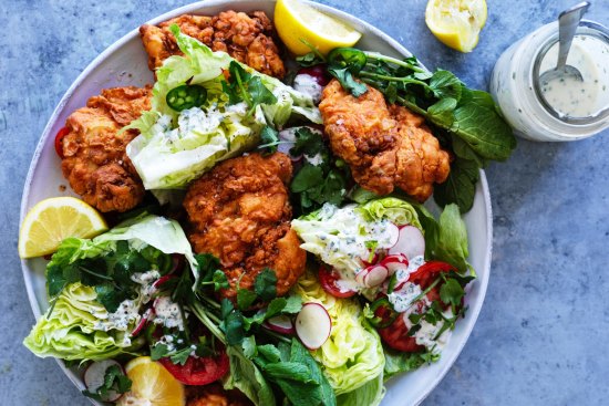 Buttermilk fried chicken cutlets with iceberg wedges, jalapeno and coriander dressing.