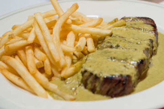 Signature dish: Steak, green salad with dijon vinaigrette and bottomless fries.