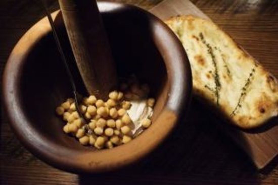 Warm hummus with freshly baked taboon Palestinian bread.