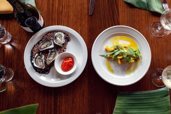 Sydney Rock oysters with fermented chilli and a dish of pickled squid (vindaye) with turmeric, mustard and sorrel