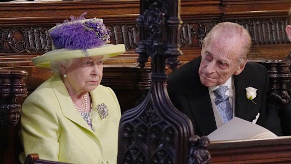 One is not amused: Queen Elizabeth II listens to Michael Curry.
