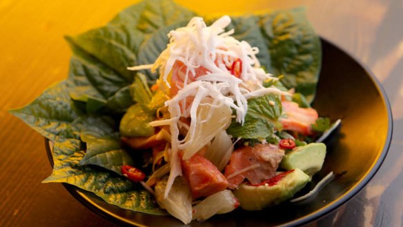 Tea-smoked ocean trout with betel leaves.