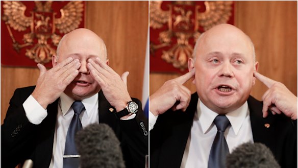Russian Ambassador Grigory Logvinov gestures to reporters during a lengthy press conference in Canberra.