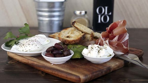 Altogether now: Italian brekkie board with two poached eggs, prosciutto, avocado, Persian feta and marinated olives served with sourdough.