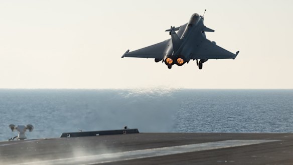 A French army Rafale fighter jet taking off from the deck of France's aircraft carrier Charles De Gaulle, in the Mediterranean sea. The French Defence Ministry says it has launched its first airstrikes from the carrier , bombing Islamic State targets in the Iraqi cities of Ramadi and Mosul. 