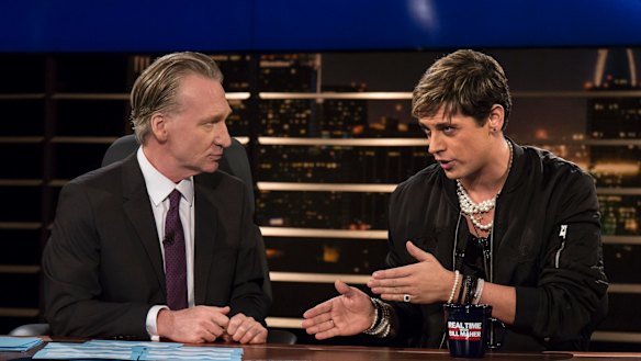 Bill Maher, left, listens to Milo Yiannopoulos, a writer for Breitbart News, on HBO's "Real Time with Bill Maher"