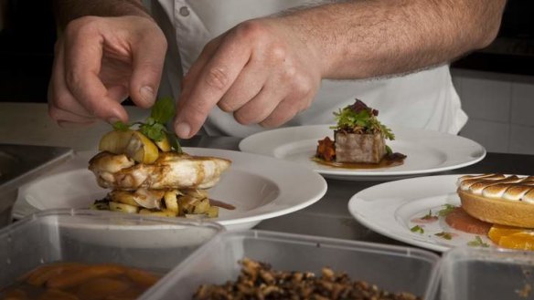 Crispy roast chicken served with parmesan and sage potatoes, slow baked apple and a cider sauce: Head chef Eric Menarol at the Sculpture Garden restaurant at the National Gallery of Australia.