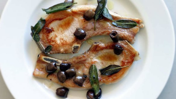 Pan fried pork chops with olives and sage.