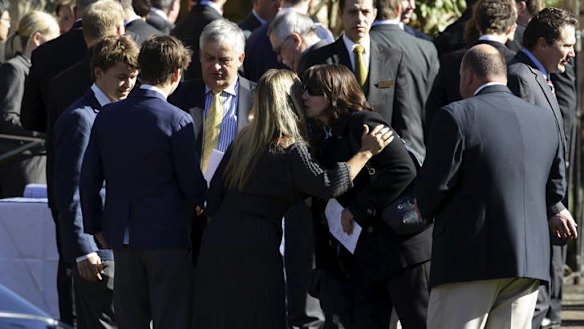 Sad farewell ... family and friends of Thomas Kelly gather for his funeral.