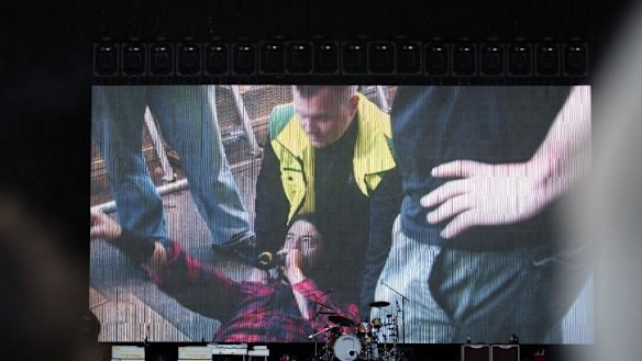 The show must go on: Dave Grohl continues despite injuring his leg.