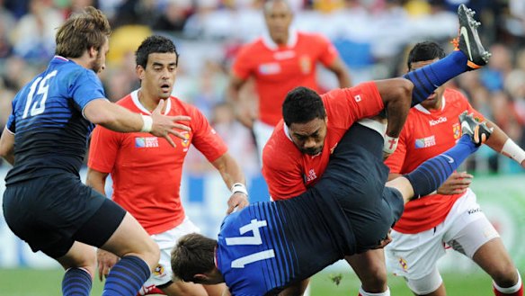 Tonga's Sukanaivalu Hufanga upends France's Vincent Clerc.