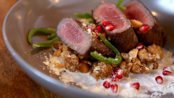 Mutton backstrap, macadamia milk, pomegranate and cauliflower.