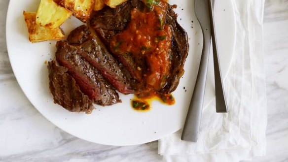 Spice things up ... Grilled aged rib-eye with tomato, onion and chipotle salsa.