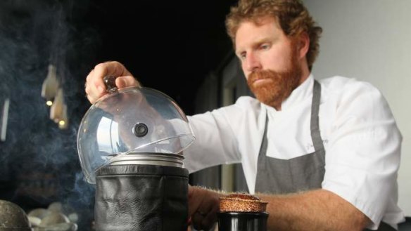 Cory Campbell with his tonka bean souffle and chocolate ice-cream, cold smoked with coconut husk.