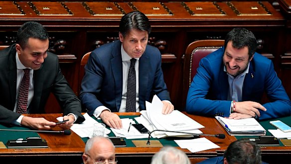 Italian PM Giuseppe Conte is flanked by Interior Minister Matteo Salvini, right, and Labour Minister Luigi Di Maio.