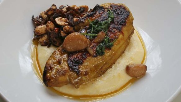 Satay-marinated chicken leg with creamy polenta.