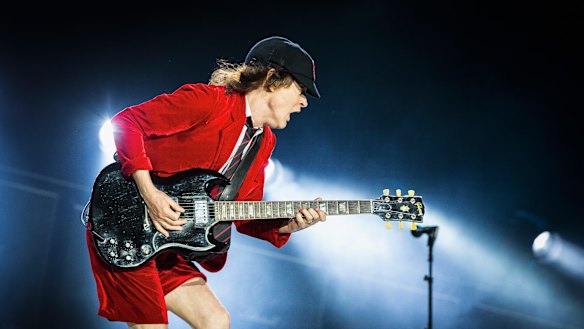 Angus Young of AC/DC: A generation of retired musicians has been forced to pick up their instruments and go back on tour.