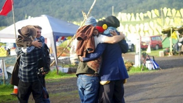 Hugs all round: protesters at the Bentley camp celebrate the drilling suspension. 