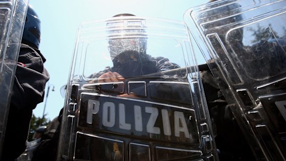 ROME - JULY 07:  Italian riot police stand guard during a demonstration near the Sapienza university prior to the arrival of the world G8 leaders for their summit on July 7, 2009, Rome, Italy. World leaders attending the G8 summit are expected to discuss tackling world hunger and the global reduction of greenhouse gases.  (Photo by Miguel Villagran/Getty Images)