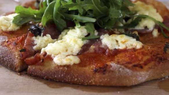 The one dish you must try ... wholemeal wood-fired pizza with sweet pork and fennel sausage, fromage blanc and basil, $15.