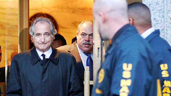 Bernard Madoff leaves court after a bail hearing in New York in 2009.