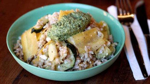 Yellow carrot and pearl barley salad with zucchini, feta and pesto.