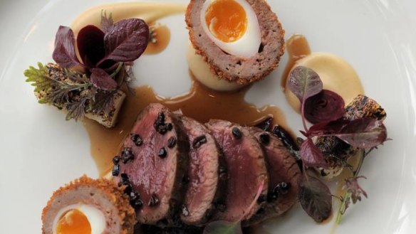 Loin of venison with venison scotch egg and  braised red cabbage at Aubergine, Canberra's best.