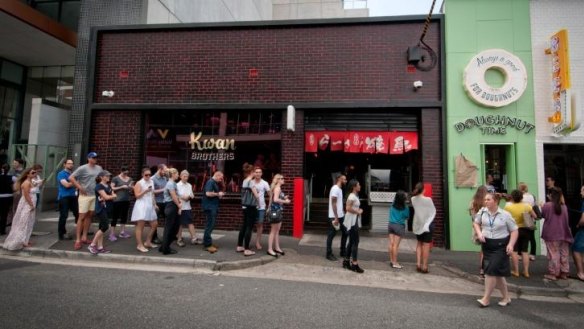 People queue for doughnuts at Doughnut Time, Fortitude Valley.