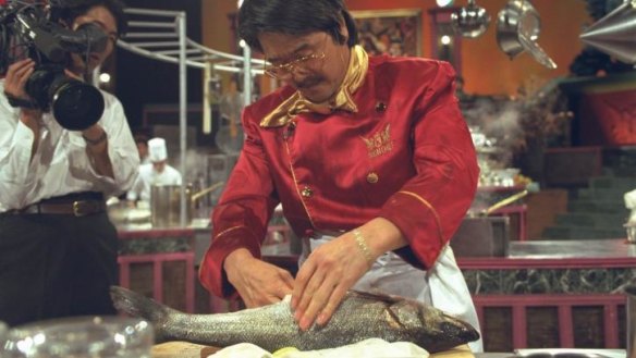 French Iron Chef Hiroyuki Sakai at work in Kitchen Stadium.
