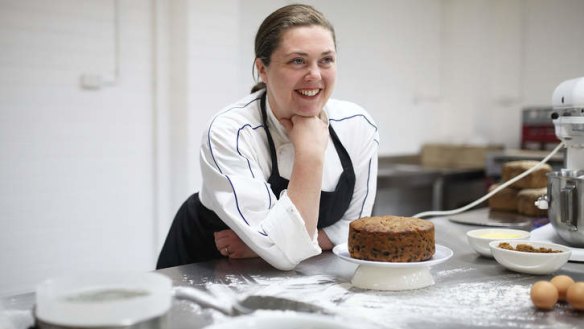 Baker Odette Martini with one of her Christmas cakes.