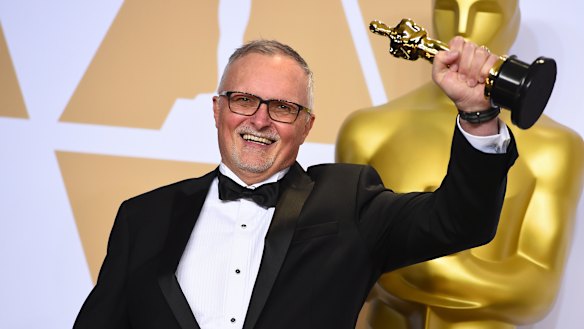Australian film editor Lee Smith poses with his Oscar.