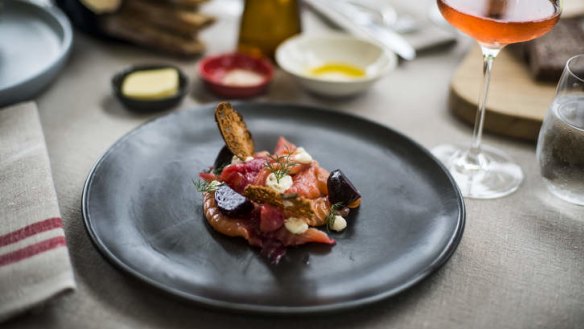 Beet-stained salmon gravlax with horseradish cream.