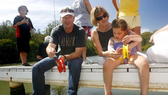 Charitable work ... Steve Waugh with occupational therapy lecturer Imelda Burgman, and Pangari Clark, 7, who has Rett syndrome.