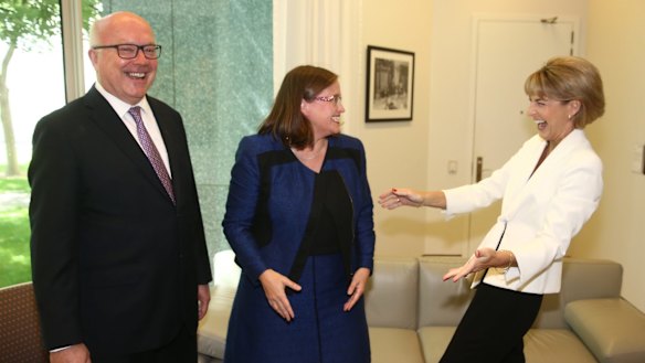 Minister for Women Michaelia Cash congratulates Kate Jenkins on her announcement as the new Sex Discrimination Commissioner with Attorney-General George Brandis at Parliament House on Thursday.