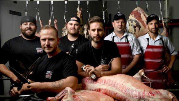 Scotch & Smoke barbecue team's Nick Cooper, Scott Windon, Brad Johnston with barber Eden Worthington and Australian Meat Emporium butchers Mark Fuda and Adam Carlson. All will compete at Meatstock this weekend. 