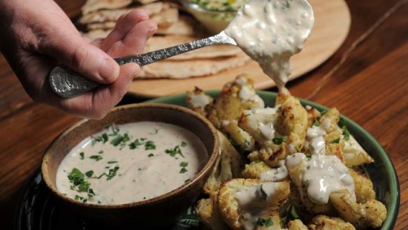 Roasted cauliflower with tahini sauce makes a great contribution to a Middle Eastern spread.
