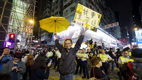 A pro-democracy protester shows a sign saying, "I want true universal suffrage", during demonstrations in Hong Kong in November 2014.