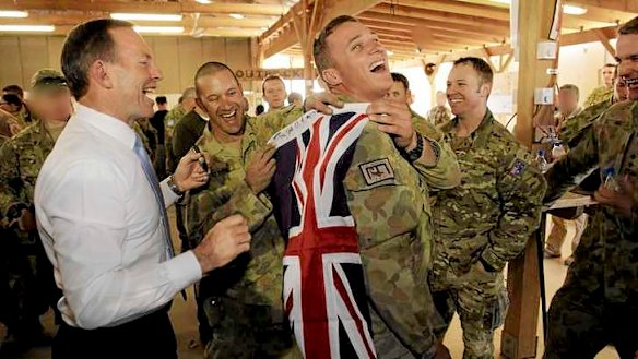 Abbott meets with troops.