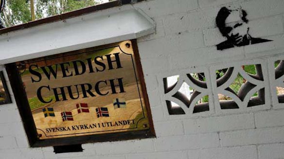 A stencil of Julian Assange on the fence of the old Swedish Consulate in Toorak.