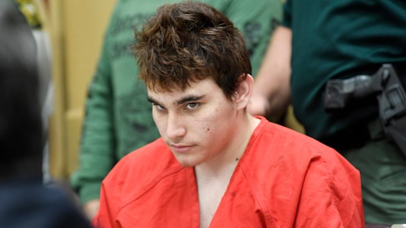 Florida school shooting suspect Nikolas Cruz looks up while in court for a hearing in Fort Lauderdale, Florida.