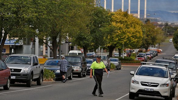 A local worker crosses the road in the Morwell town center. Photo: Eddie Jim