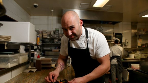 Shane Delia plating the poached mussels with saffron and moghrabieh couscous served at his restaurant Maha.