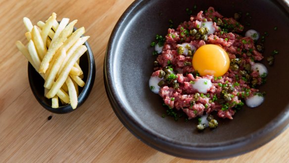 Beef tartare, smoked yolk and fries served at Enquire Within.