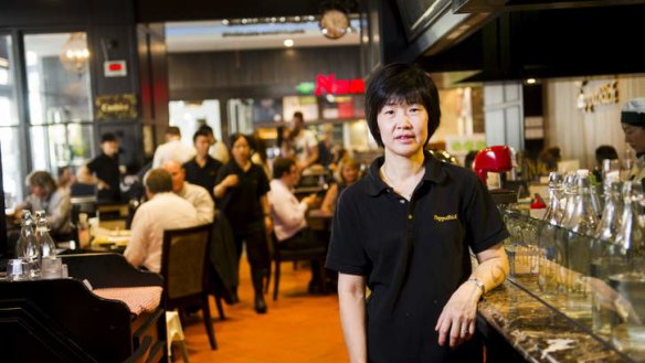 Loud and bustling: PappaRich Malaysian Delights. Pictured is owner Angie Ng.
